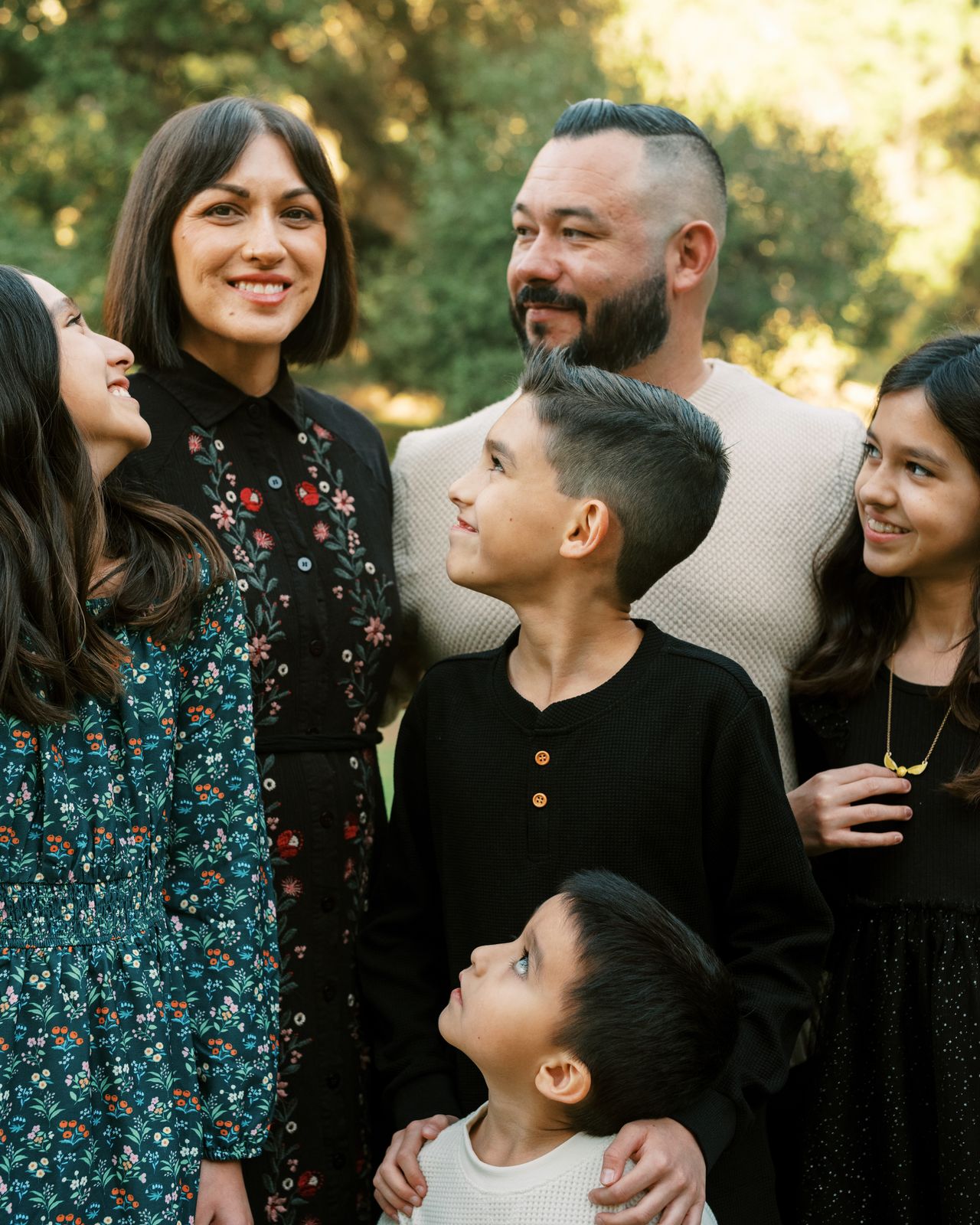 A family looking down at their youngest son