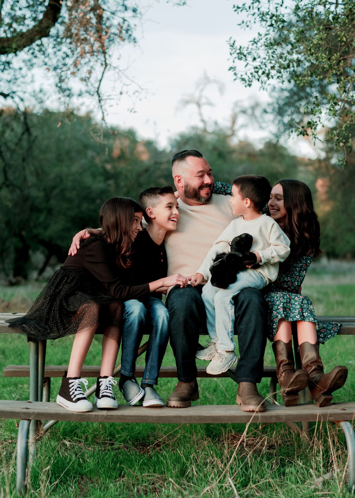 A family on a bench, from their private gallery