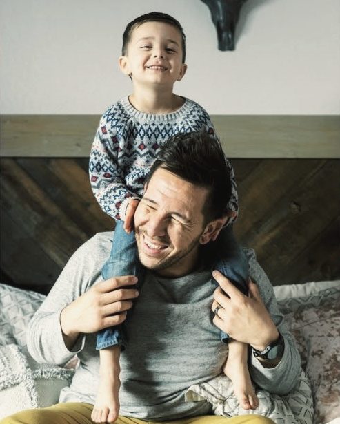 Dad giving his son a shoulder ride